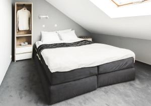 Posteľ alebo postele v izbe v ubytovaní Apartamenty Forma Tatrica