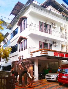 an elephant standing in front of a building at Shiva Inn in Guruvāyūr