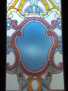 a stained glass window with a rainbow at Guesthouse Kalosorisma in Tsagarada