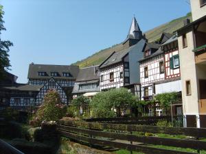 a group of buildings in a town with stairs at Schau-Rhein#2 - on Top of Bacharach, Rhineview in Bacharach
