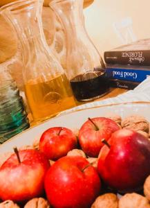 a plate of apples and peanuts on a table at La Trigola in Santo Stefano di Magra