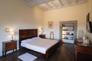 Postel nebo postele na pokoji v ubytování Palazzo Mazzini