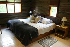 Postel nebo postele na pokoji v ubytování HOTEL IGUAIMA