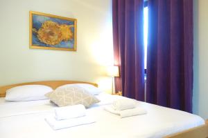 Postel nebo postele na pokoji v ubytování Villa Quantum Beograd