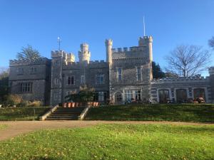 an old castle on a grassy field at Harbour Mews Central Location Near Beach in Whitstable