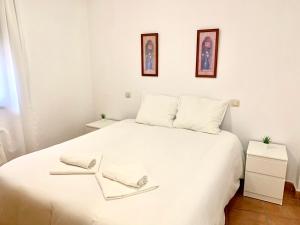 Rúm í herbergi á APARTAMENTO ALAMILLO Alto