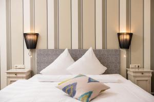 Postel nebo postele na pokoji v ubytování Hotel die Hindenburg