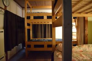 Postel nebo postele na pokoji v ubytování Guest house SHIE SHIMI