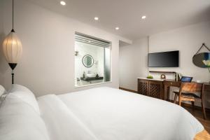 Voodi või voodid majutusasutuse Hanoi Exclusive Hotel toas