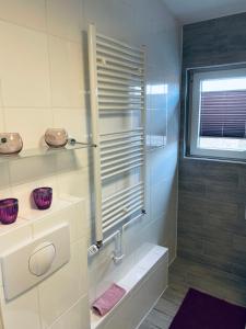 a bathroom with a walk in shower and a sink at Ferienwohnung mit Balkon in Calden in Calden +21 photos