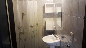 Koupelna v ubytování Departamentos Flor de Loto + 54 fotografií