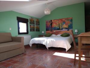 Tempat tidur dalam kamar di Hotel Rural La Casa del Tio Telesforo