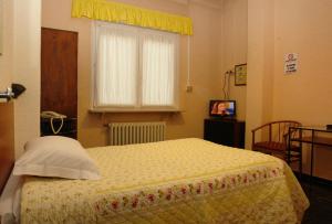 Postel nebo postele na pokoji v ubytování Hotel Torrismondi