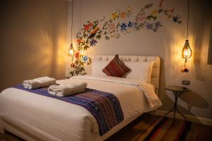 Postel nebo postele na pokoji v ubytování Home Garden Hotel