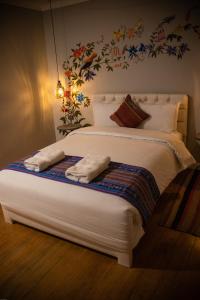 Postel nebo postele na pokoji v ubytování Home Garden Hotel