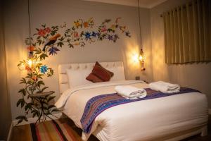 Postel nebo postele na pokoji v ubytování Home Garden Hotel