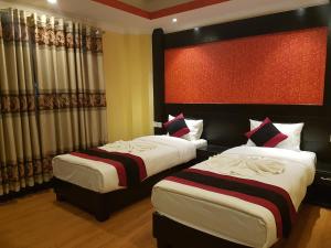 Voodi või voodid majutusasutuse Kathmandu Regency Hotel toas