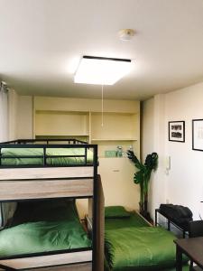 Tempat tidur susun dalam kamar di Joinus Ise Apartment
