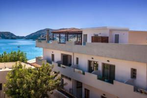 a building with a view of the water at Thania Seaside Smotel - Adults Only in Agia Pelagia