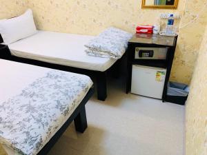 Voodi või voodid majutusasutuse Victoria Inn toas