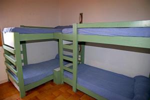Palanda nebo palandy na pokoji v ubytování Résidence Marina di Capitello