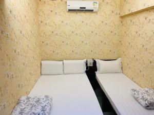 Voodi või voodid majutusasutuse Victoria Inn toas
