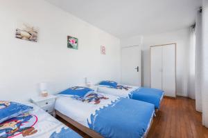 Katil atau katil-katil dalam bilik di Smart apartment Val d'Europe 7/9 pers