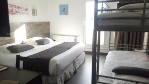 Cama ou camas em um quarto em Hotel De L'Europe