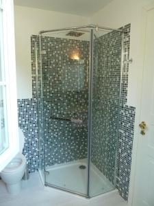 a bathroom with a glass shower with a toilet at Caterina.C B&B in Val Della Torre