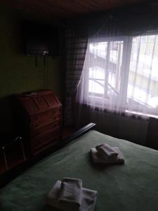 Postel nebo postele na pokoji v ubytování Гостинний Двір + 89 fotografií