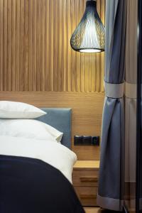 Posteľ alebo postele v izbe v ubytovaní Mountain Apartments Jagiellońska Residence