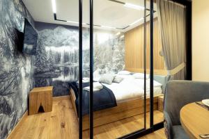 Posteľ alebo postele v izbe v ubytovaní Mountain Apartments Jagiellońska Residence