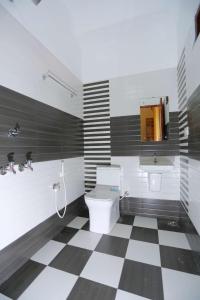 Kylpyhuone majoituspaikassa Dayout Regency