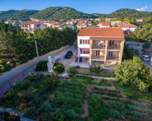 an aerial view of a house with a garden at Apartments Anita 1 in Barbat na Rabu