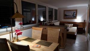 a room with a bed and a table and a bedroom at PenthouseApartment 250° in Sonthofen +19 photos