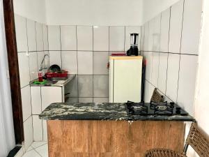 Een keuken of kitchenette bij Kitnets da vana