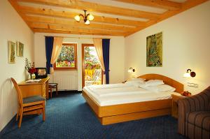Postel nebo postele na pokoji v ubytování Hotel Öhlerhof