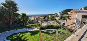 a view of a city from a balcony of a house at Quinta de Palames in Sesimbra