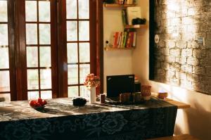 a room with a table with a computer on it at Sum Villa Homestay Mang Den in Kon Von Kla