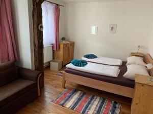 Llit o llits en una habitació de Tuxie Haus