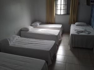 
A bed or beds in a room at Almeidas Hotel
