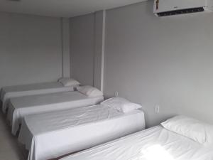 
A bed or beds in a room at Almeidas Hotel
