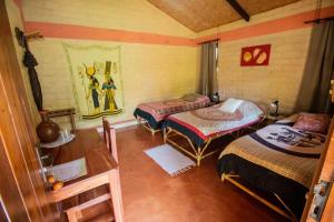 Кровать или кровати в номере Pousada Aruana
