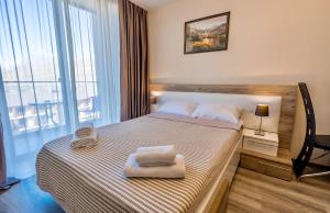 Cama ou camas em um quarto em GVC 510 New Gudauri Mountain view