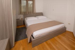 Postel nebo postele na pokoji v ubytování Apartments Oliva