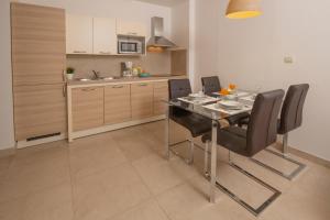 Kuchyň nebo kuchyňský kout v ubytování Apartments Oliva