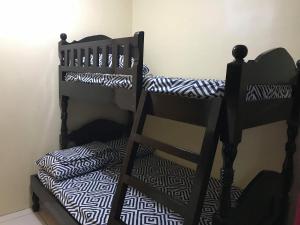 A bed or beds in a room at RV3 TRANSIENT HOUSE