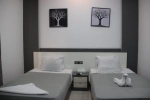 Postel nebo postele na pokoji v ubytování Azar Boutique Hotel