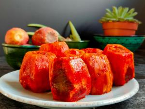a plate of red peppers on a table at Villa Shepherd Lajares - LUXURY VILLA FUERTEVENTURA in Lajares