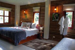 Postel nebo postele na pokoji v ubytování HOTEL IGUAIMA